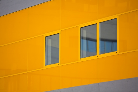 Modern office buildings. Colorful buildings in a industrial place. Orange windows.の写真素材