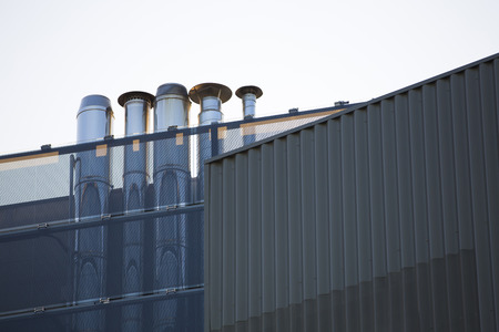 Chimney modern building with sky blueの写真素材