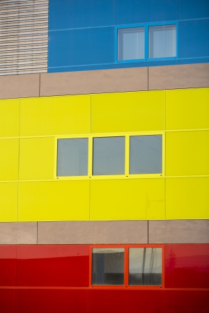 Modern office buildings. Colorful buildings in a industrial place. Yellow, blue and red windows.の写真素材
