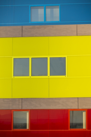 Modern office buildings. Colorful buildings in a industrial place. Yellow, blue and red windows.の写真素材