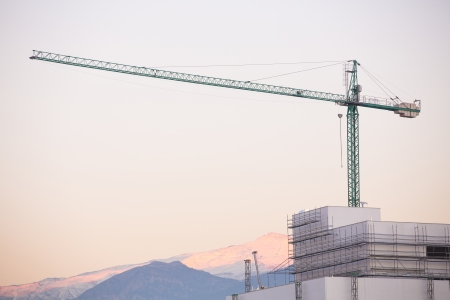 Construction site with crane. Sierra Nevada in the background.の写真素材