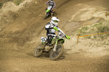 GRANADA, SPAIN - APRIL 20 : Unknown racer on the competition " Motocross Championship to Granada" on April 20, 2014 in Granada, Spainのeditorial素材