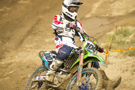 GRANADA, SPAIN - APRIL 20 : Unknown racer on the competition " Motocross Championship to Granada" on April 20, 2014 in Granada, Spainのeditorial素材