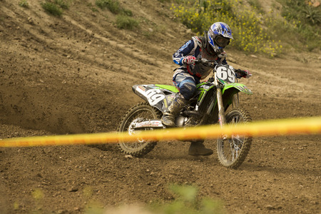 GRANADA, SPAIN - APRIL 20 : Unknown racer on the competition " Motocross Championship to Granada" on April 20, 2014 in Granada, Spainのeditorial素材