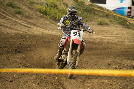 GRANADA, SPAIN - APRIL 20 : Unknown racer on the competition " Motocross Championship to Granada" on April 20, 2014 in Granada, Spainのeditorial素材