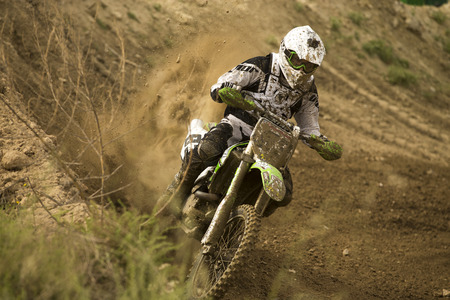 GRANADA, SPAIN - APRIL 20 : Unknown racer on the competition " Motocross Championship to Granada" on April 20, 2014 in Granada, Spainのeditorial素材