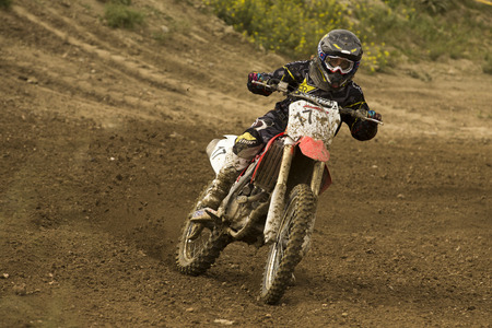 GRANADA, SPAIN - APRIL 20 : Unknown racer on the competition " Motocross Championship to Granada" on April 20, 2014 in Granada, Spainのeditorial素材