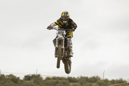 GRANADA, SPAIN - APRIL 20 : Unknown racer on the competition " Motocross Championship to Granada" on April 20, 2014 in Granada, Spainのeditorial素材