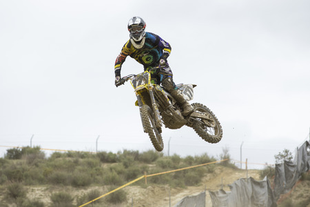 GRANADA, SPAIN - APRIL 20 : Unknown racer on the competition " Motocross Championship to Granada" on April 20, 2014 in Granada, Spainのeditorial素材