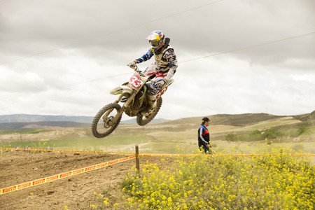 GRANADA, SPAIN - APRIL 20 : Unknown racer on the competition " Motocross Championship to Granada" on April 20, 2014 in Granada, Spainのeditorial素材