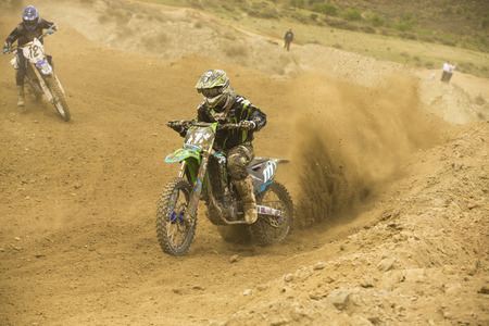 GRANADA, SPAIN - APRIL 20 : Unknown racer on the competition " Motocross Championship to Granada" on April 20, 2014 in Granada, Spainのeditorial素材