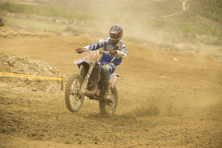 GRANADA, SPAIN - APRIL 20 : Unknown racer on the competition " Motocross Championship to Granada" on April 20, 2014 in Granada, Spainのeditorial素材