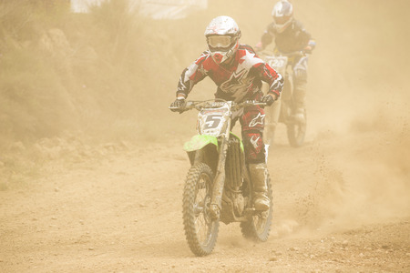 GRANADA, SPAIN - APRIL 20 : Unknown racer on the competition " Motocross Championship to Granada" on April 20, 2014 in Granada, Spainのeditorial素材