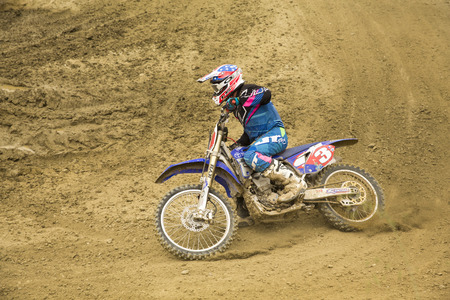 GRANADA, SPAIN - APRIL 20 : Unknown racer on the competition " Motocross Championship to Granada" on April 20, 2014 in Granada, Spainのeditorial素材
