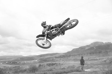 GRANADA, SPAIN - APRIL 20 : Unknown racer on the competition " Motocross Championship to Granada" on April 20, 2014 in Granada, Spainのeditorial素材