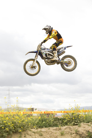 GRANADA, SPAIN - APRIL 20 : Unknown racer on the competition " Motocross Championship to Granada" on April 20, 2014 in Granada, Spainのeditorial素材