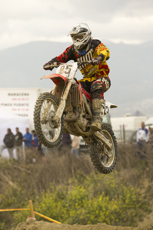 GRANADA, SPAIN - APRIL 20   Unknown racer on the competition   Motocross Championship to Granada  on April 20, 2014 in Granada, Spainのeditorial素材
