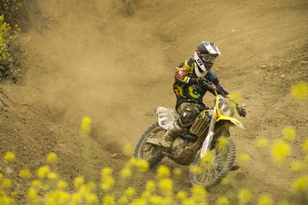 GRANADA, SPAIN - APRIL 20   Unknown racer on the competition   Motocross Championship to Granada  on April 20, 2014 in Granada, Spainのeditorial素材