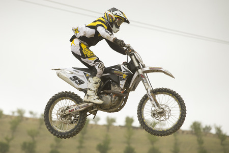 GRANADA, SPAIN - APRIL 20   Unknown racer on the competition   Motocross Championship to Granada  on April 20, 2014 in Granada, Spainのeditorial素材