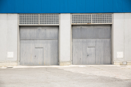 Shutter door, outside of factory.の写真素材