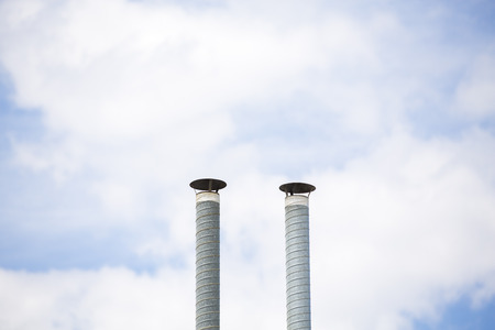 Two ventilation pipes over blue sky closeupの写真素材