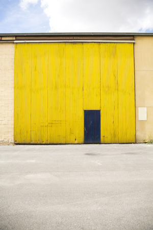 Shutter door, outside of factory.の写真素材