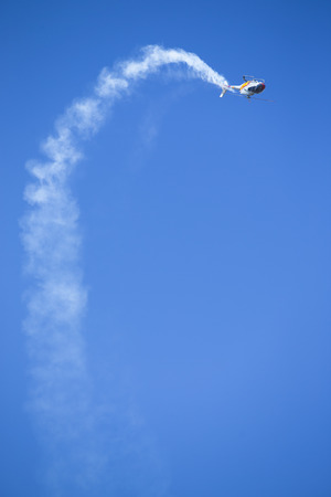 GRANADA,SPAIN - May 18: Aerobatic Spanish helicopter patrol (ASPA Patrol) perform at airshow (10Âº Aanniversary of Aspa Patrol in Granada) on May 18, 2014 in Granada ,Spainのeditorial素材