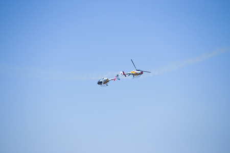 GRANADA,SPAIN - May 18: Aerobatic Spanish helicopter patrol (ASPA Patrol) perform at airshow (10Âº Aanniversary of Aspa Patrol in Granada) on May 18, 2014 in Granada ,Spainのeditorial素材