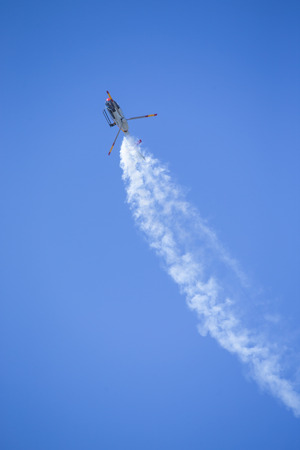 GRANADA,SPAIN - May 18: Aerobatic Spanish helicopter patrol (ASPA Patrol) perform at airshow (10Âº Aanniversary of Aspa Patrol in Granada) on May 18, 2014 in Granada ,Spainのeditorial素材