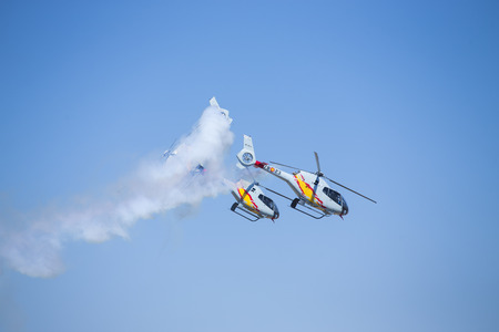 GRANADA,SPAIN - May 18: Aerobatic Spanish helicopter patrol (ASPA Patrol) perform at airshow (10Âº Aanniversary of Aspa Patrol in Granada) on May 18, 2014 in Granada ,Spainのeditorial素材