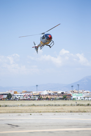 GRANADA,SPAIN - May 18: Aerobatic Spanish helicopter patrol (ASPA Patrol) perform at airshow (10Âº Aanniversary of Aspa Patrol in Granada) on May 18, 2014 in Granada ,Spainのeditorial素材