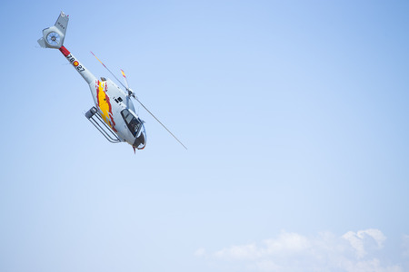 GRANADA,SPAIN - May 18: Aerobatic Spanish helicopter patrol (ASPA Patrol) perform at airshow (10Âº Aanniversary of Aspa Patrol in Granada) on May 18, 2014 in Granada ,Spainのeditorial素材
