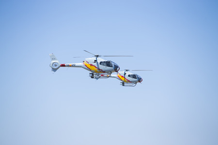 GRANADA,SPAIN - May 18: Aerobatic Spanish helicopter patrol (ASPA Patrol) perform at airshow (10Âº Aanniversary of Aspa Patrol in Granada) on May 18, 2014 in Granada ,Spainのeditorial素材