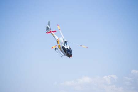 GRANADA,SPAIN - May 18: Aerobatic Spanish helicopter patrol (ASPA Patrol) perform at airshow (10Âº Aanniversary of Aspa Patrol in Granada) on May 18, 2014 in Granada ,Spainのeditorial素材