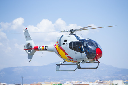 GRANADA,SPAIN - May 18: Aerobatic Spanish helicopter patrol (ASPA Patrol) perform at airshow (10Âº Aanniversary of Aspa Patrol in Granada) on May 18, 2014 in Granada ,Spainのeditorial素材