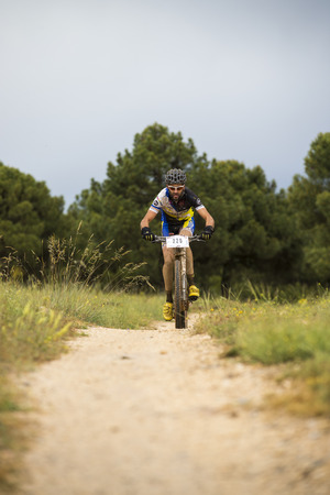 GRANADA, SPAIN - JUNE 1: Unknown racer on the competition of the mountain bike "La Mamut Padul Bike" on June 1, 2014 in Granada, Spainのeditorial素材