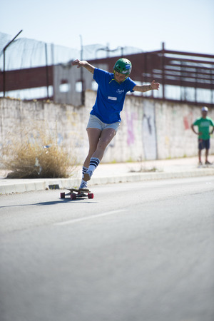 CORDOBA, SPAIN - APRIL 14: Unknown racer on the competition of the long board "1Âª Competition Longboard & Slalom city of Cordoba" on Arpil 14, 2013 in Cordoba, Spainのeditorial素材