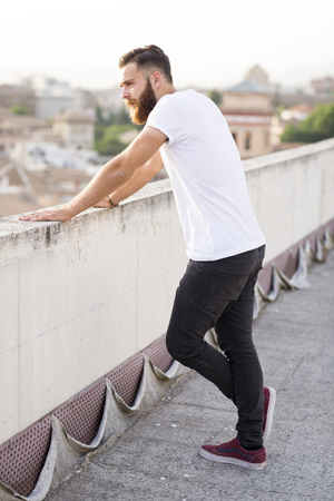 Bearded man posing in the street.の写真素材