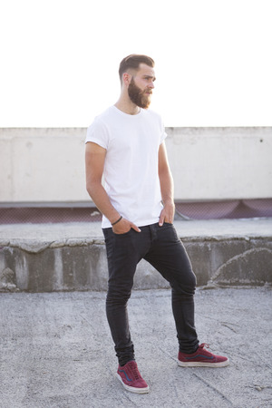 Bearded man posing in the street.の写真素材