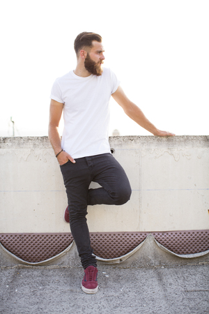 Bearded man posing in the street.の写真素材