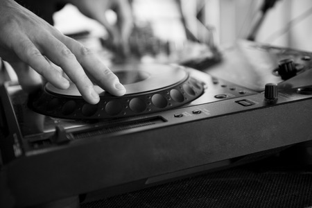 Dj mixes the track in the nightclub at partyの写真素材