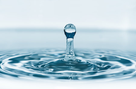 Drop in water. Blue waterdrop macro shotの写真素材