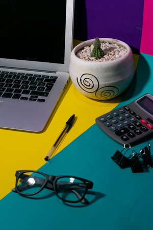 Vertical desk with laptop, and penの写真素材