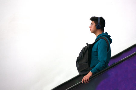 Young man listening to music with headphones