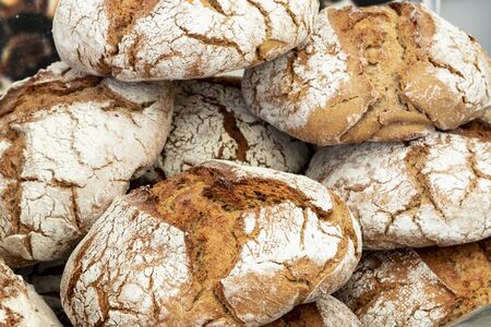 A closeup of delicious small sourdoughs on each other under the lights - food conceptの写真素材