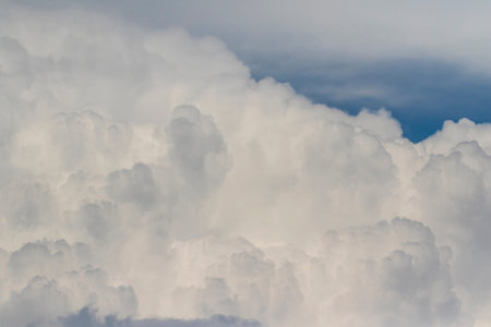 Cumulus cloud over blue sky. Precursor clouds of a storm