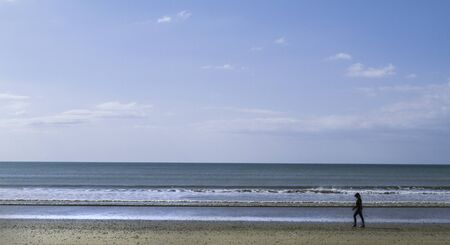 seaside landscape with the horizon in the background and blue sky with cloudsの写真素材