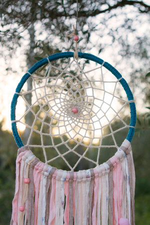 dreamcatcher suspended in a tree. relax and handmade. Handcraft and ecological