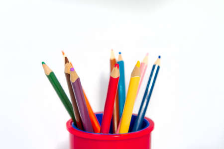 Colored pencils in a glass isolated on a white backgroundの写真素材