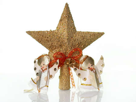 Christmas star and two small angels        の写真素材